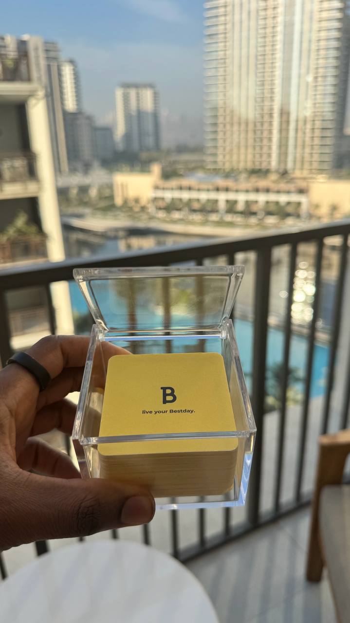 Bestday Topics held up against Dubai skyline