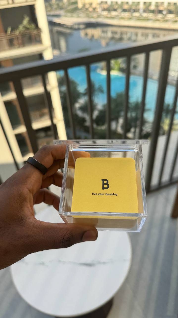 Bestday Topics held up on balcony with pool view